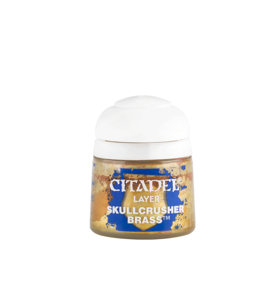 A small paint pot with a broad white cap and a gold-and-blue label, shown upright against a plain green background. The label reads “CITADEL,” “LAYER,” and “SKULLCRUSHER BRASS.”