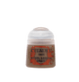 A small Citadel paint pot stands upright, with a white rounded flip-top lid and a brown-toned body. Its orange-red splatter label reads “CITADEL,” “BASE” and “STEEL LEGION DRAB.”