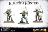 Three painted Kurnoth Hunter miniatures stand on round bases, each posed with a turquoise-blue bow; their bark-like armor and leafy details are brown, green, and gold. Text reads “SYLVANETH,” “KURNOTH HUNTERS,” and “3 CITADEL MINIATURES.”