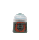 A small Citadel paint pot stands against a plain green background, with a rounded white cap and a dark green body. Its orange-red label reads “CITADEL,” “BASE,” and “WAAAGH! FLESH.”