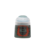 A small Citadel paint pot stands against a plain green background, with a rounded white cap and a dark green body. Its orange-red label reads “CITADEL,” “BASE,” and “WAAAGH! FLESH.”