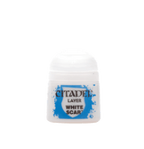 A small white Citadel paint pot with a rounded cap and bright blue splatter graphic on the label. The label reads “CITADEL,” “LAYER,” and “WHITE SCAR.”