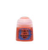 A small squat pot of red miniature paint stands alone against a plain background, with a translucent pale pink cap and a blue-and-red splatter label reading “CITADEL,” “LAYER,” and “WILD RIDER RED.”