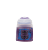 A squat purple Citadel paint pot stands centered against a solid green background, with a rounded pale lavender cap and a blue-and-purple splatter label. The label reads “CITADEL,” “LAYER,” and “XEREUS PURPLE.”
