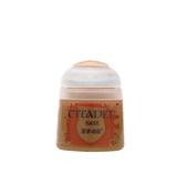 A small squat paint pot with a translucent white cap and an ochre-brown body, shown upright against a plain green background. Its orange-red label reads “CITADEL,” “BASE” and “XV-88.”