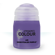 A squat purple paint bottle with a pale translucent cap stands against a white background. Its front label reads “CITADEL COLOUR,” “AIR” and “GENESTEALER PURPLE.”