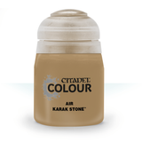 A squat, tan-brown Citadel paint bottle stands upright against a white background, with a large white cap and black label text reading “CITADEL COLOUR,” “AIR,” and “KARAK STONE.”