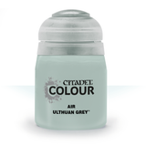 A squat pale grey-green paint bottle with a large rounded white cap, shown upright against a white background. Its front label reads “CITADEL COLOUR” and “AIR ULTHUAN GREY.”