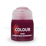 A squat pot of deep burgundy base paint stands against a white background, with a pale translucent pink cap. Its front label reads “COLOUR,” “BASE,” and “BARAK-NAR BURGUNDY.”