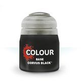 A squat black paint pot with a translucent gray lid is shown upright against a white background. Its label has a red splatter graphic and the white text “COLOUR,” “BASE,” and “CORVUS BLACK.”