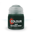 A squat pot of very dark green paint with a pale gray screw-on lid, shown upright against a white background. The label reads “COLOUR,” “BASE,” and “NOCTURNE GREEN.”