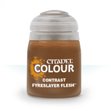 A squat brown paint bottle with a wide white cap stands against a plain white background. Its front label has an orange splash graphic and the text “CITADEL COLOUR,” “CONTRAST,” and “FYRESLAYER FLESH.”