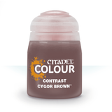 A squat, rounded brown paint pot stands upright against a white background, with a pale translucent cap and an orange splash graphic on the label. The label reads “CITADEL COLOUR,” “CONTRAST,” and “CYGOR BROWN.”