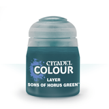 A squat dark teal paint pot with a rounded pale blue-gray cap stands against a white background. Its label reads “CITADEL COLOUR,” “LAYER,” and “SONS OF HORUS GREEN,” with a blue splatter graphic.