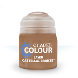 A small squat bottle of brown-bronze hobby paint stands upright against a white background, with a pale translucent cap. Its front label reads “CITADEL COLOUR,” “LAYER,” and “CASTELLAX BRONZE.”
