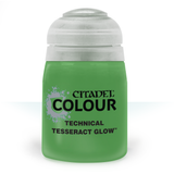 A squat green paint pot with a wide white cap, shown upright against a white background. Its black label reads “CITADEL COLOUR,” “TECHNICAL,” and “TESSERACT GLOW.”