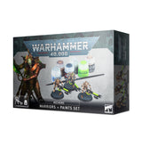 Front of a dark gray Warhammer 40,000 Necrons Warriors + Paints Set box, angled to show its right side. The packaging shows three miniature sci-fi warriors, paint pots and a brush, with artwork of a larger armored figure; text reads “WARHAMMER 40,000” and “NECRONS WARRIORS + PAINTS SET”.