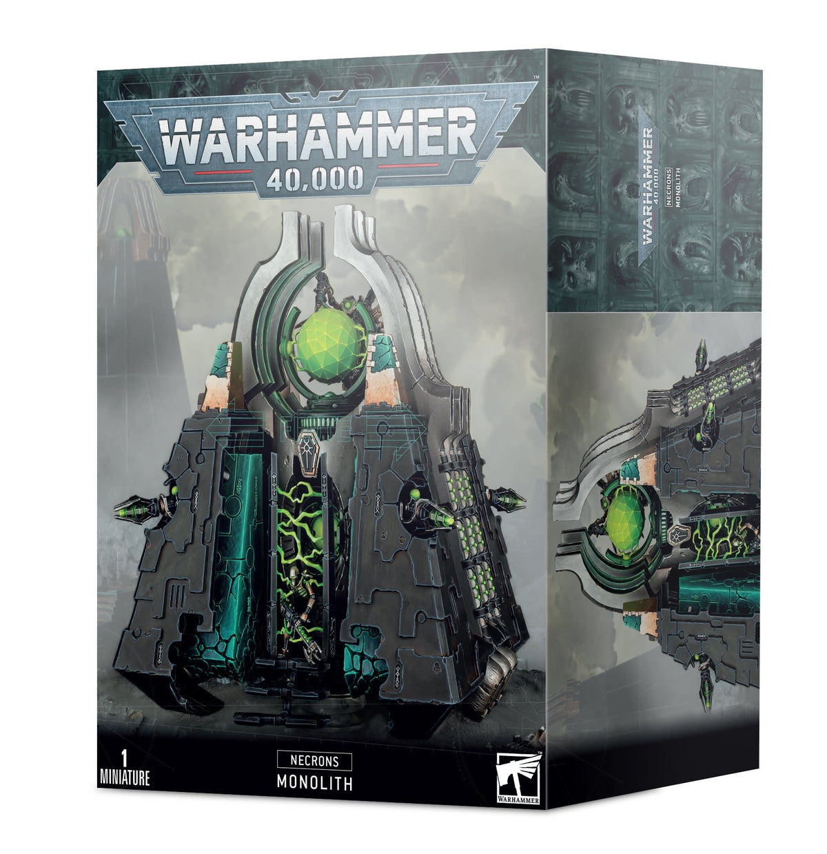 Box for a Necrons Monolith miniature, shown with the front and right side visible. Artwork depicts a dark gray, angular sci-fi structure with glowing green details; the front reads “WARHAMMER 40,000,” “NECRONS MONOLITH,” and “1 MINIATURE.”