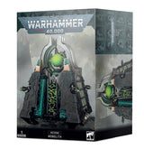 Box for a Necrons Monolith miniature, shown with the front and right side visible. Artwork depicts a dark gray, angular sci-fi structure with glowing green details; the front reads “WARHAMMER 40,000,” “NECRONS MONOLITH,” and “1 MINIATURE.”