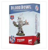 Box for a Blood Bowl Treeman miniature, shown at an angle with the front and right side visible. The blue-and-red package features artwork of a branch-covered tree creature with small figures perched on its limbs and the text “BLOOD BOWL” and “TREEMAN.”