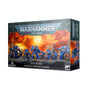 Box for a set of blue-armored Space Marine miniatures, shown from the front and right side against a white background. The artwork depicts warriors on an orange, fiery battlefield; the front reads “WARHAMMER 40,000,” “SPACE MARINES” and “ASSAULT INTERCESSORS.”