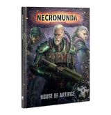 A hardback Necromunda expansion book shown at an angle, with a dark sci-fi cover depicting three armored figures and a large green gun held by the white-haired central figure. The cover reads “NECROMUNDA” and “HOUSE OF ARTIFICE.”