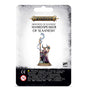 Front of a hanging Warhammer miniature package with a white and gray card and black warning panel. The artwork shows a horned figure in purple robes holding a staff and an ornate object; text reads “WARHAMMER AGE OF SIGMAR” and “SHARDSPEAKER OF SLAANESH.”