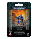 Dark green and black Warhammer 40,000 package with an orange central panel showing a blue-and-gold armored Space Marine captain holding a large rifle. Text reads “WARHAMMER 40,000,” “SPACE MARINES” and “CAPTAIN WITH MASTER-CRAFTED HEAVY BOLT RIFLE.”