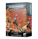 Angled Warhammer 40,000 miniature box showing the front and right side. The artwork depicts a pale warrior in black armor with flowing red hair and blades, leaping over rocky ground; the box reads “DRUKHARI” and “LELITH HESPERAX.”