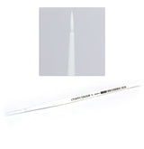A long white Citadel shade brush lies diagonally with a clear protective cap over its handle end; an inset shows the pointed white bristles upright in close-up. The handle reads “CITADEL COLOUR” and “STC SHADE M.”