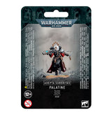 A painted Adepta Sororitas Palatine miniature stands centered on dark Warhammer 40,000 packaging, wearing black armor with red-and-white details and holding weapons. The card reads “WARHAMMER 40,000” and “ADEPTA SORORITAS PALATINE.”