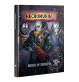 Angled hardback book cover titled “NECROMUNDA” and “HOUSE OF SHADOW,” showing a pale, bald figure in dark armor holding a red-and-black weapon, with two masked figures behind against a smoky, ember-speckled background.