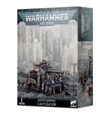 Box for the Adepta Sororitas Castigator miniature, shown from the front and right side. The artwork features a dark armored tank with a long cannon, gold ornamentation and a small figure against a grayscale gothic backdrop; the box reads “WARHAMMER 40,000” and “ADEPTA SORORITAS CASTIGATOR”.