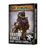 Black Necromunda card box shown from the front and right side, with artwork of a man riding a battered blue vehicle and a white skull emblem. The front reads “NECROMUNDA” and “CAWDOR VEHICLE GANG TACTICS CARDS”; the side reads “CAWDOR VEHICLE GANG TACTICS CARDS.”
