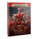 Hardcover Battletome: Blades of Khorne shown from the front with its red spine visible. The dark red and gray cover depicts a muscular horned warrior amid a battle scene and reads “WARHAMMER AGE OF SIGMAR” and “CHAOS BATTLETOME BLADES OF KHORNE.”