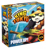 King of Tokyo: Power Up! expansion game box shown at an angle, with a panda-like monster amid green energy on a blue burst background. The front reads “KING OF TOKYO” and “POWER UP!”; the narrow side repeats the title and character artwork.
