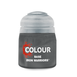 A squat, dark gray paint pot with a translucent light gray cap, shown upright against a black background. The label reads “COLOUR,” “BASE,” and “IRON WARRIORS.”