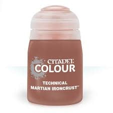 Small rounded paint pot with a pale pink translucent ridged lid and reddish-brown body, shown upright on a white background. The label reads “CITADEL COLOUR” and “TECHNICAL MARTIAN IRONCRUST.”