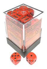Opaque orange six-sided dice with black pips fill a clear square display container, with two loose dice in front showing different faces. The label reads “CHESSEX” and “CHX 25803.”