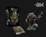 A painted fantasy Jarl miniature crouches in green and gold armor, holding a long spear on a round base with a pale blue sculpted creature head and grass. Its box and illustrated card are shown beside it, with “CONQUEST” and “JARL” on the box.