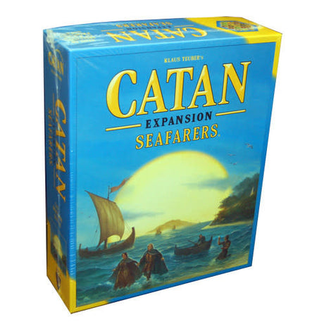 Catan: Seafarers board game expansion box shown at an angle, with a blue and yellow cover depicting settlers in boats sailing toward an island at sunset. The front reads “CATAN,” “EXPANSION,” and “SEAFARERS.”