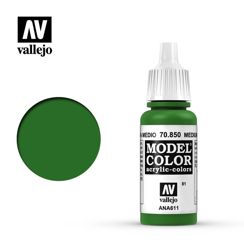 A green Vallejo paint bottle with a white dropper cap and label stands beside a large dark green circular color swatch. The label reads “MODEL COLOR” and “vallejo,” with “ANA611” printed near the bottom.