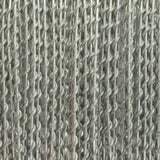 Tight close-up of gray, metallic-looking barbed wire arranged in dense parallel rows, with twisted strands and short pointed barbs repeating along the wire.