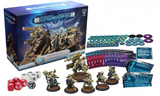 Warcaster: Marcher Worlds starter set displayed with its blue illustrated box, several painted sci-fi miniatures on round bases, red and white dice, cards, and teal and purple game tokens. The box reads “WARCASTER” and “MARCHER WORLDS.”