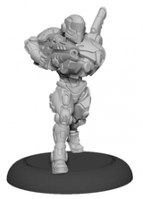 A single gray Paladin Enforcer miniature stands on a black round base, wearing a helmet and bulky, segmented armor while aiming a rifle across its body; a long cylindrical piece of equipment rises behind one shoulder.