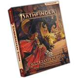 Angled view of a hardcover Pathfinder: Second Edition Gamemastery Guide, with a red spine and fantasy artwork of a red-cloaked figure facing a large horned creature. The cover reads “PATHFINDER,” “SECOND EDITION,” and “GAMEMASTERY GUIDE.”