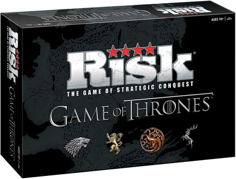 Black Risk: Game of Thrones board game box shown at an angle, with a dark map across the front and side. The front reads “RISK” and “GAME OF THRONES,” above four illustrated house sigils.