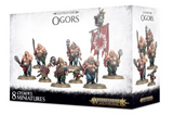 Angled view of a white and black miniature box showing several muscular fantasy Ogors with weapons and a red banner on round bases. The front reads “GUTBUSTERS OGORS” and “8 CITADEL MINIATURES,” with “WARHAMMER AGE OF SIGMAR” branding; the side repeats the figures and title.