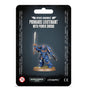 A blue armored Space Marine miniature stands on a round base on dark packaging, raising a long silver sword and holding a firearm. The card reads “SPACE MARINES” and “PRIMARIS LIEUTENANT WITH POWER SWORD,” with Warhammer 40,000 and Citadel logos below.