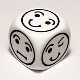 A single white six-sided die with softly rounded edges, shown close-up on a plain light background. Three visible faces each have a bold black outlined smiley face with different expressions.